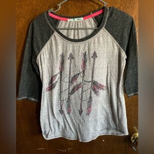 Short sleeve shirt made by Maurices size small feather print on front